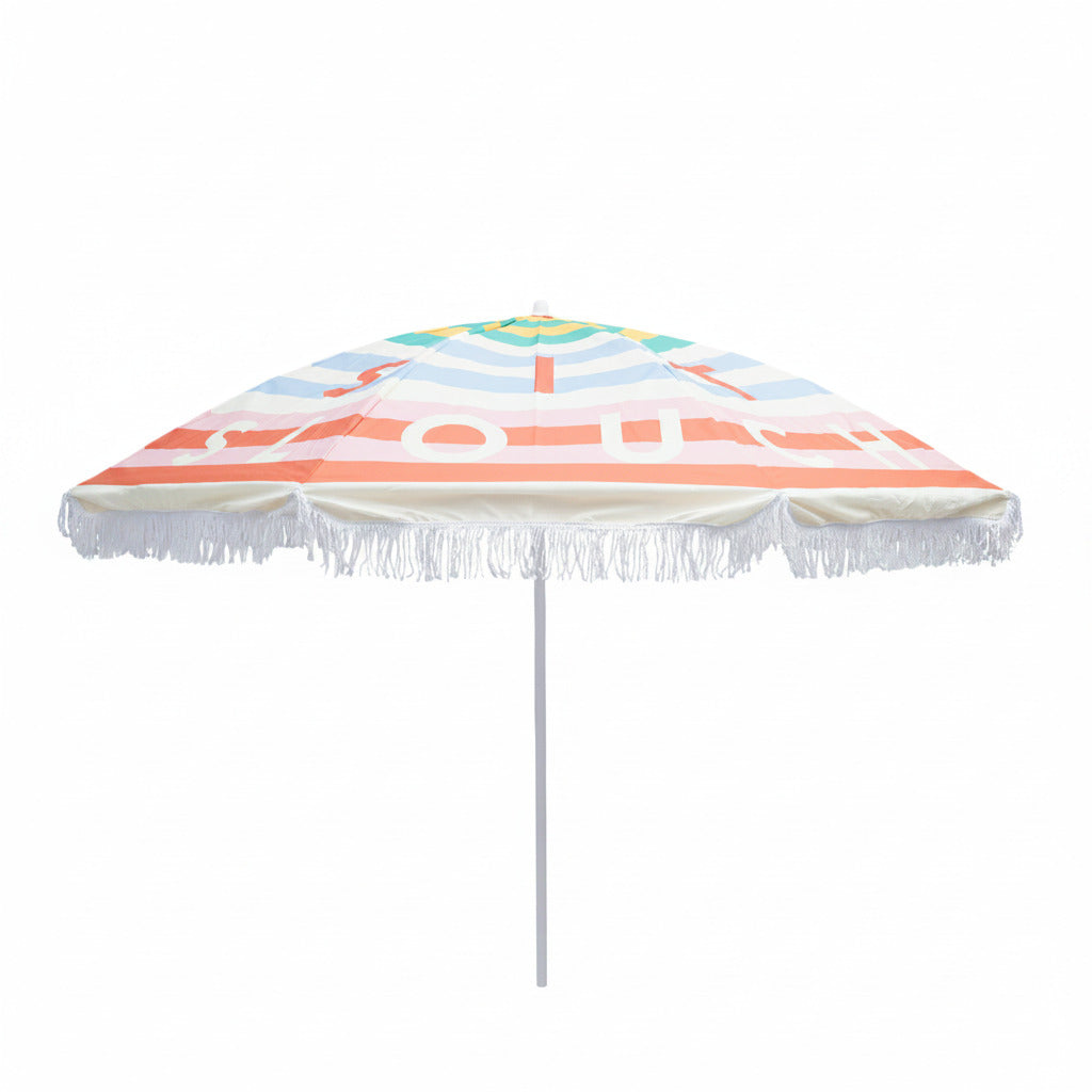 Colorful beach umbrella with striped pattern and tassels on a white background
