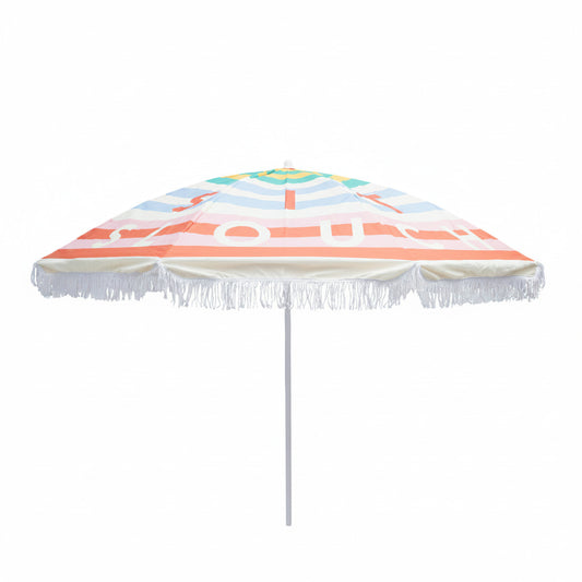 Colorful beach umbrella with striped pattern and tassels on a white background