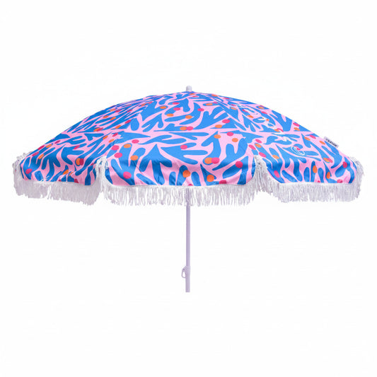 Beach umbrella with a colorful abstract pattern and white fringe on a white background